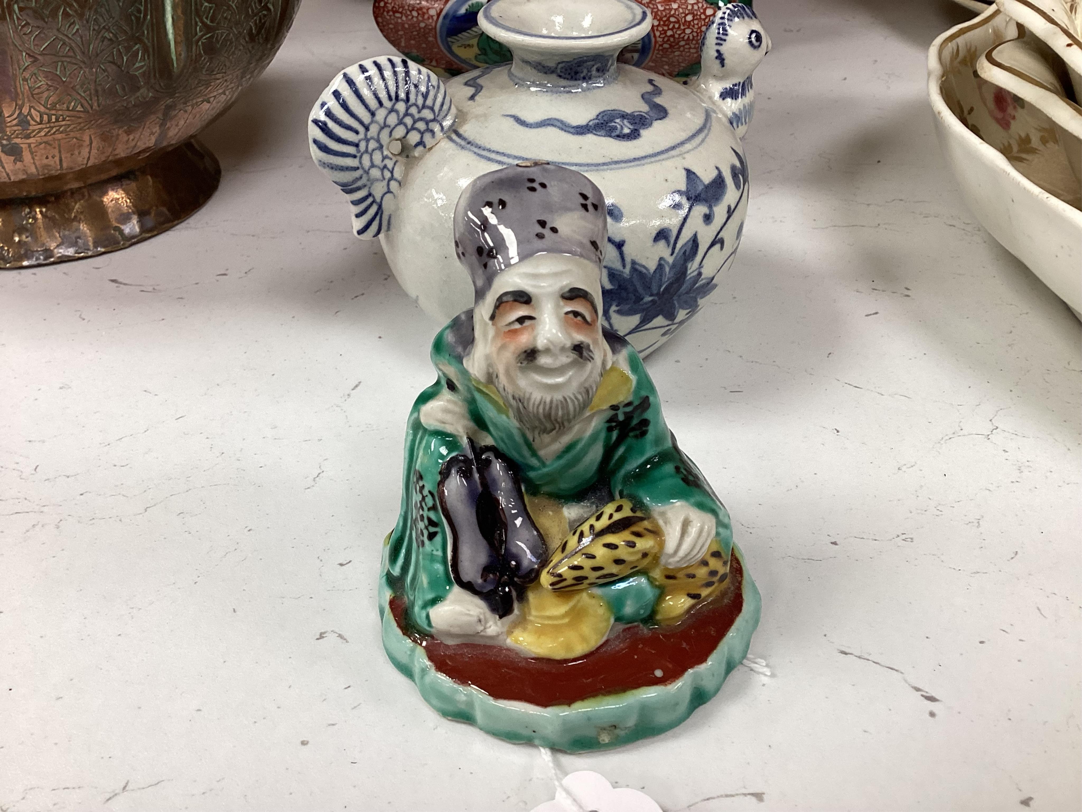A Japanese Dog of Fo, a box and cover figure and blue and white pourer, Dog of Fo, 25cm high